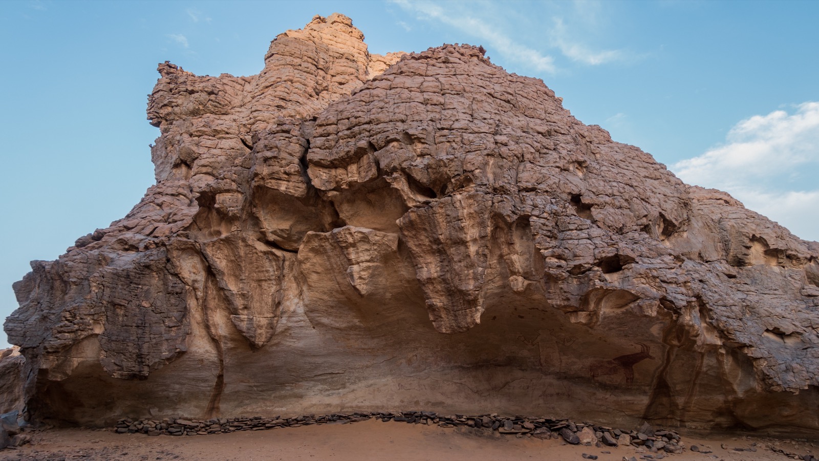 The rock shelter of the 'Great God of Sefar' in the Tassili n'Ajjer, Algeria — the painted plateau Toy crossed the Sahara to see.