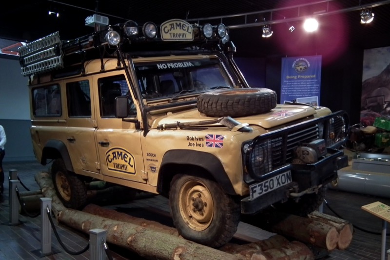 A Camel Trophy One Ten of the following year, Bob and Joe Ives's 1989 Amazon car F350 XON, at the National Motor Museum, Beaulieu — sandglow, roll cage, roof rack, bonnet spare and winch as run in Sulawesi in 1988.