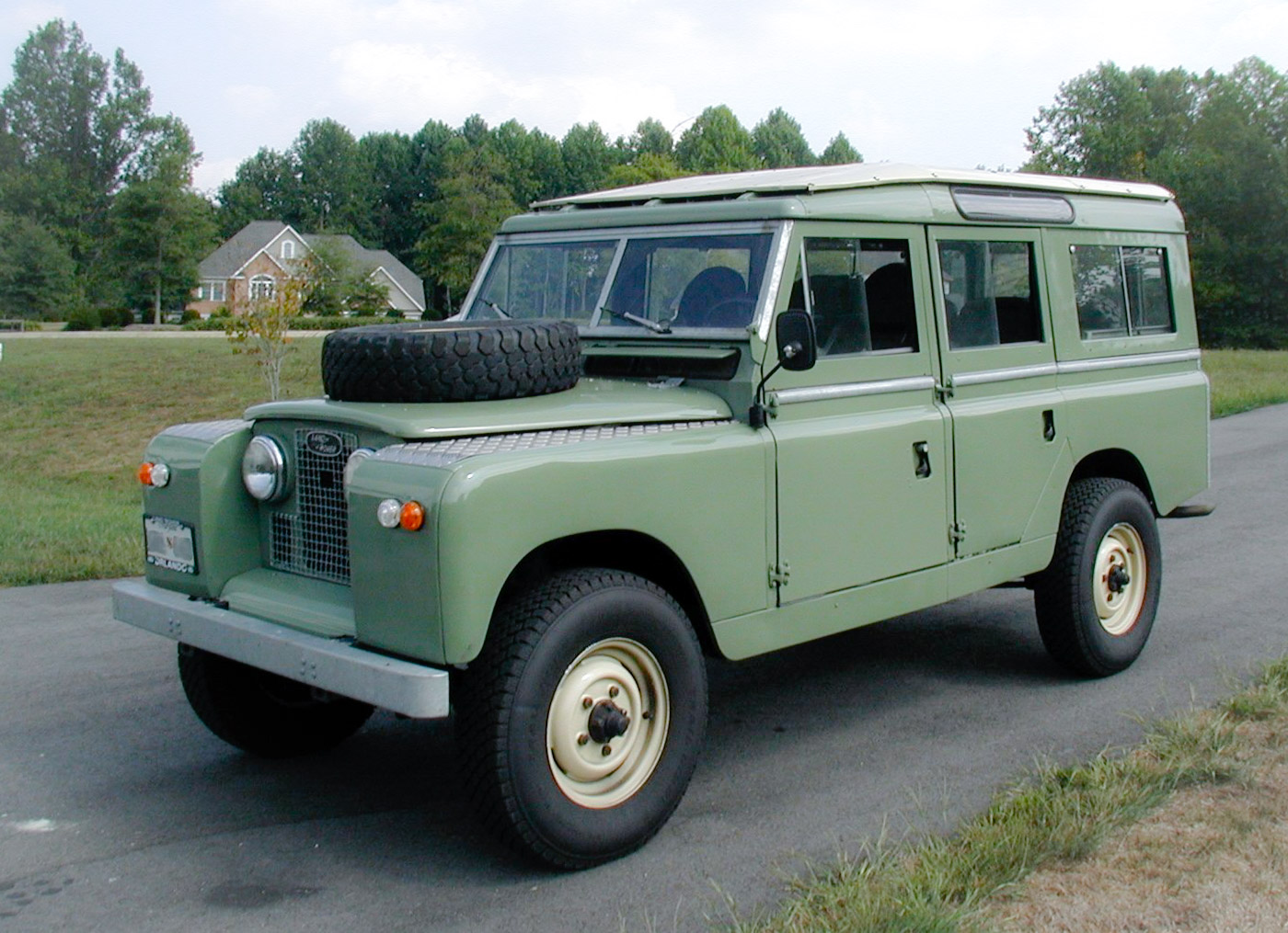 A 1966 Land Rover Series IIA 109 station wagon, the long-wheelbase type in which eight people drove from England to Kathmandu in 1964 (not the expedition car, which was blue).