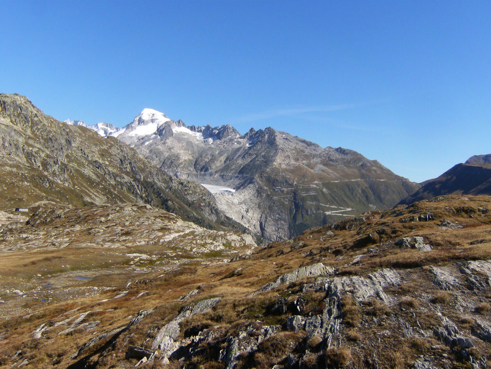 The shrunken tongue of the Rhône glacier below the Galenstock, with the Furka Pass road on the right, in September 2014 — the Swiss site of the survey.