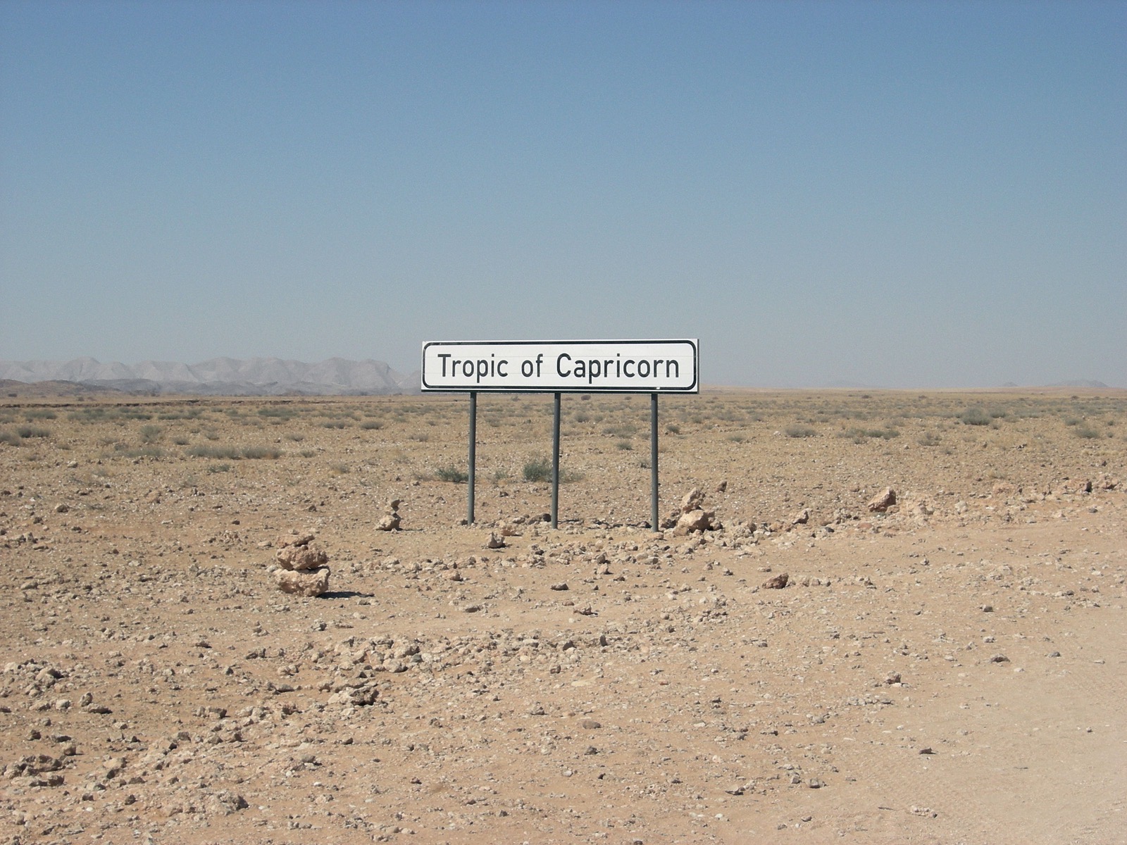 The Tropic of Capricorn sign on the road through the Namib in Namibia, the desert the expedition crossed to the Atlantic.