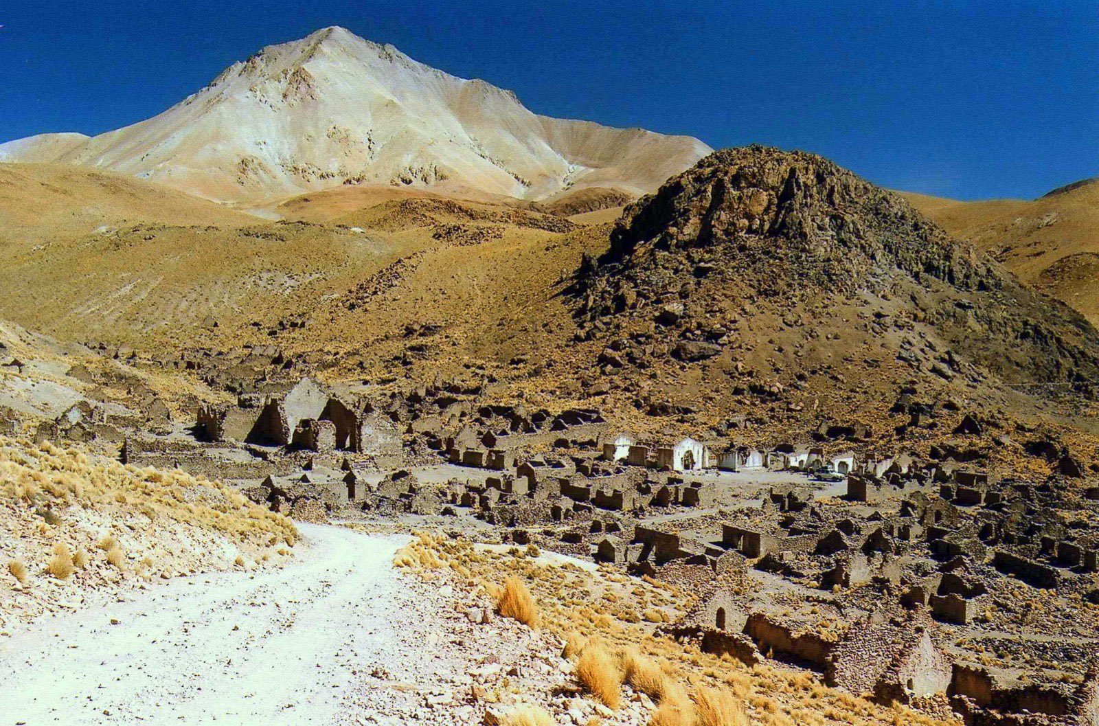 The abandoned colonial mining town of San Antonio de Lípez — the 'pueblo fantasma' — straggling down its valley at 15,200 ft, where the expedition camped in a thatched stone hut from 18 August 1966.