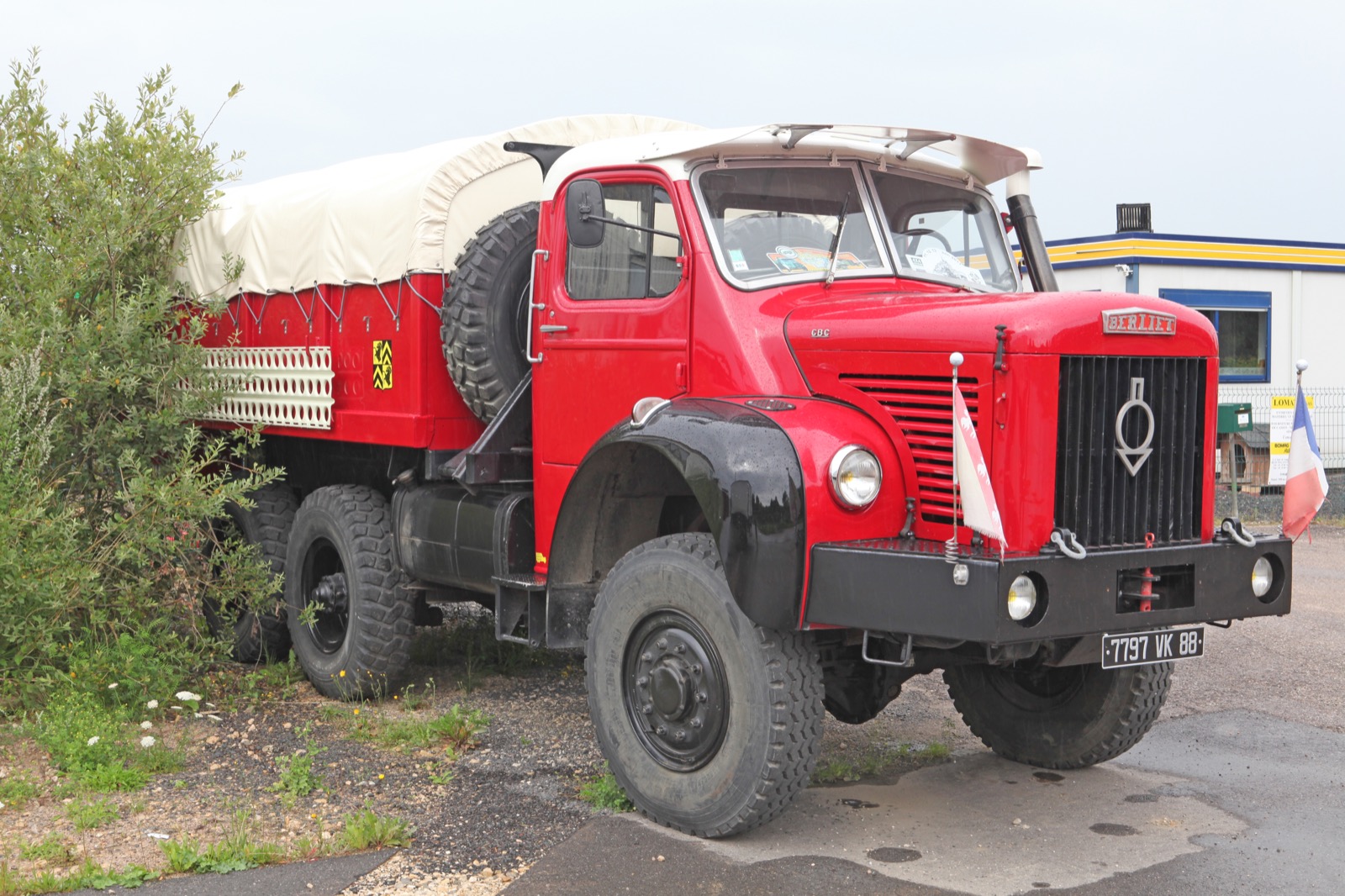 A preserved civilian-cab Berliet GBC 6x6 'Gazelle' in red — the workshop truck of the 1959 mission was this colour; the Land Rovers scouted ahead of nine such trucks.