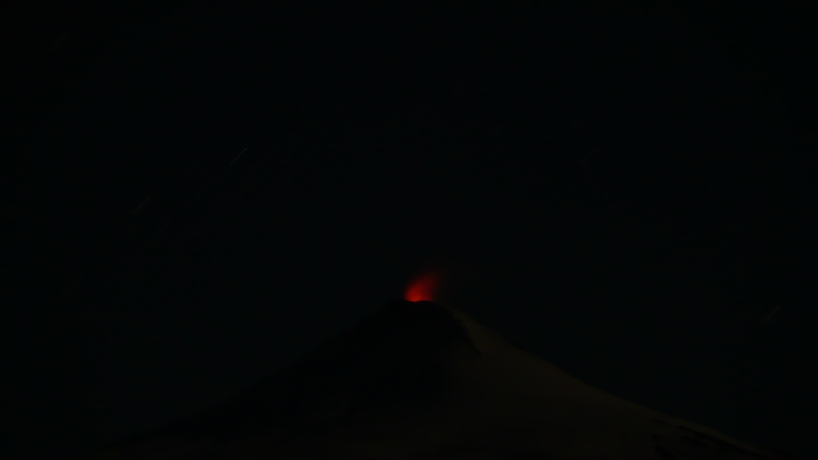 Villarrica glowing at night; the southern end of the Trail, where the team spent a month at the lava lake.