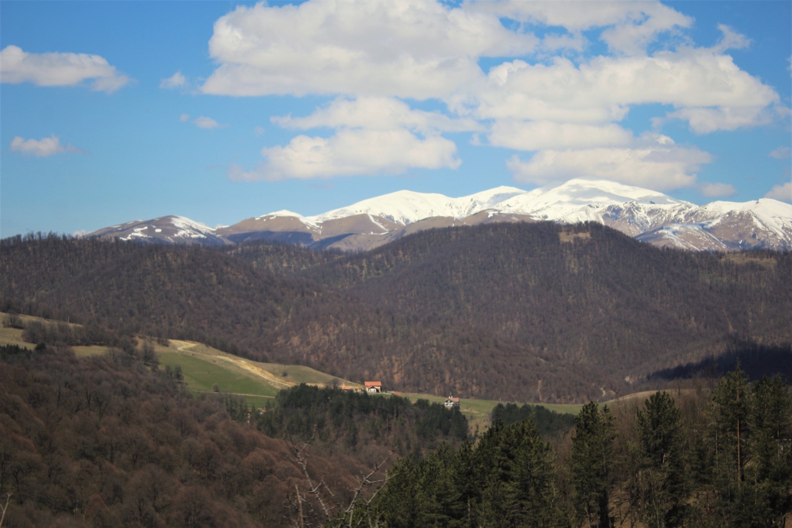 Forested ridges and snow peaks in Dilijan National Park, Armenia, where the first 100 km of the Transcaucasian Trail was built in 2017 on the expedition's survey.