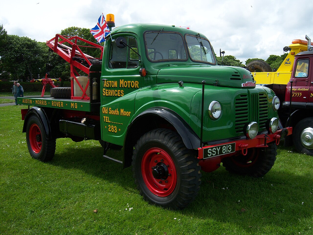 The product, not the works: a Harvey Frost hinged-boom recovery crane on a 1955 Austin K9, the same equipment thousands of Land Rover breakdown trucks carried.