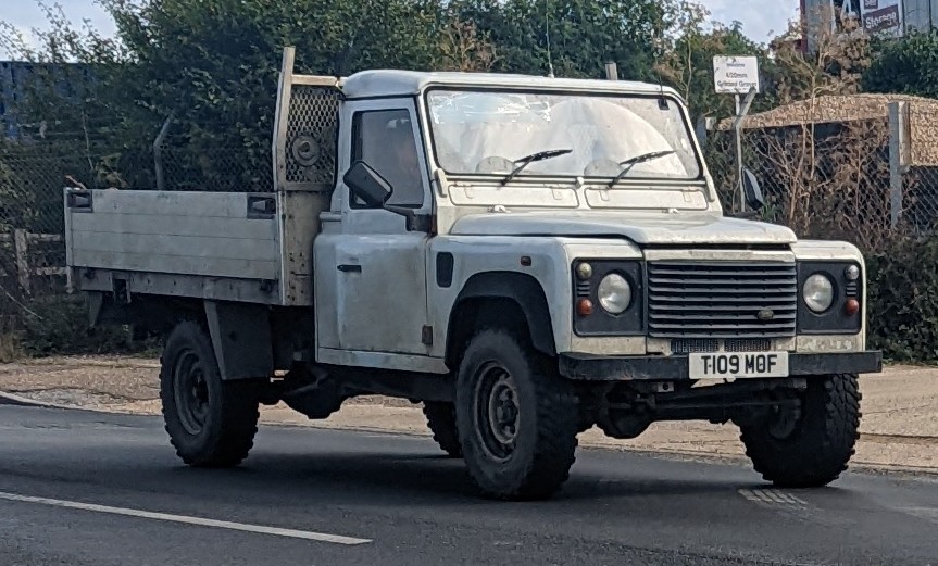 Defender 130 Hi-Cap — 1999 Defender 130 with dropside utility body in workaday white