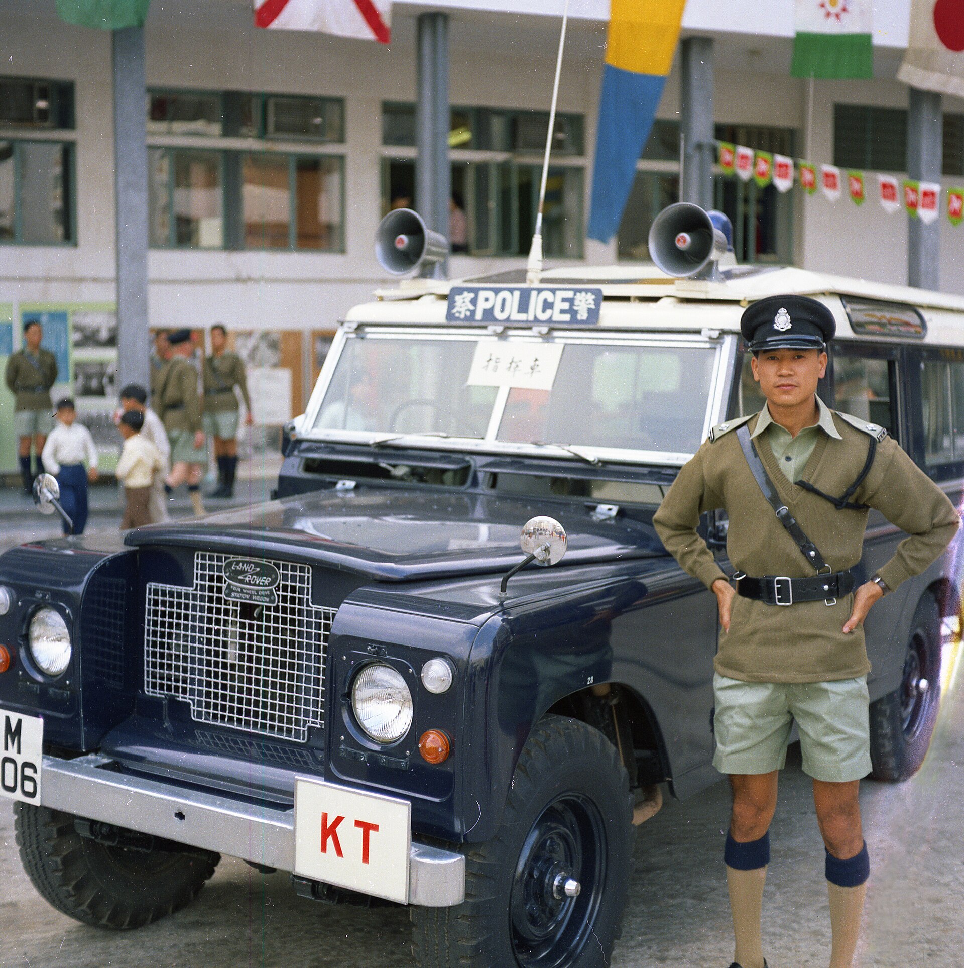 Royal Hong Kong Police Land Rover allocated to the divisional commander of Kwun Tong Police Station, autumn 1971, in the force's navy blue with roof loudspeakers and bilingual POLICE sign