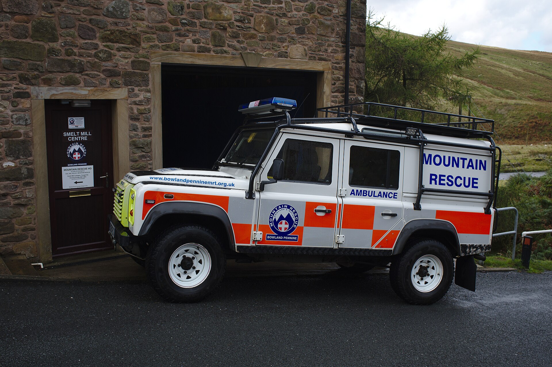 Mountain Rescue Defender 110 — Bowland Pennine MRT Defender 110 mountain rescue ambulance with roof rack and stretcher stowage at the team's Smelt Mill base